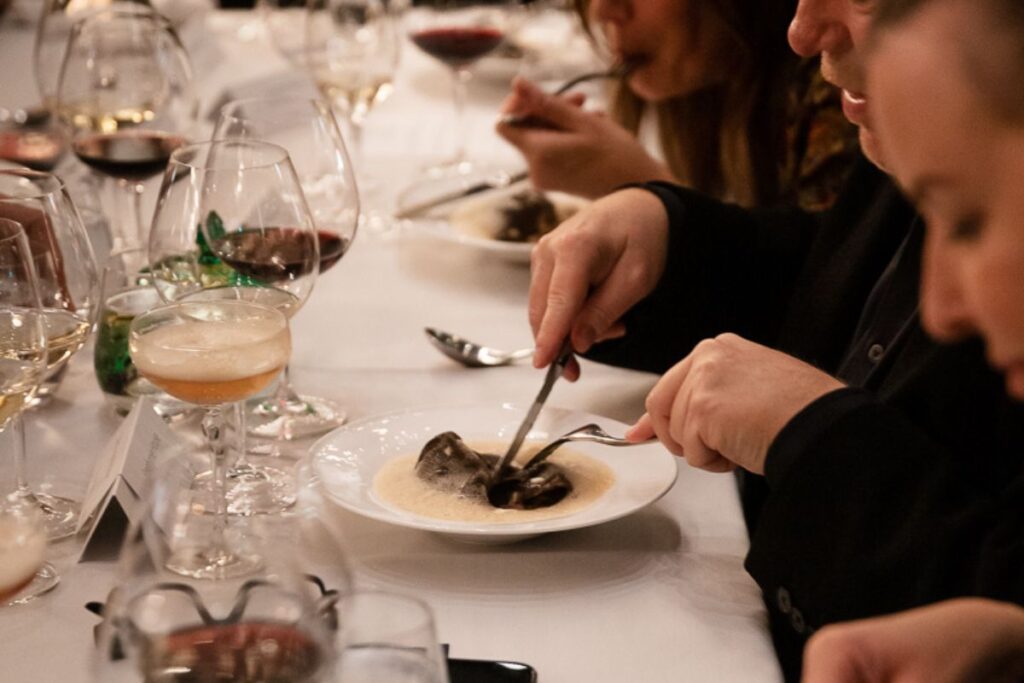 Guests enjoying a plated dinner during a private event at Acquafarina in Vancouver