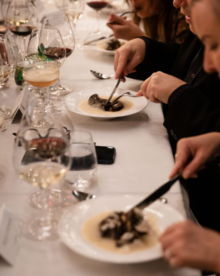 Guests enjoying a plated dinner during a private event at Acquafarina in Vancouver