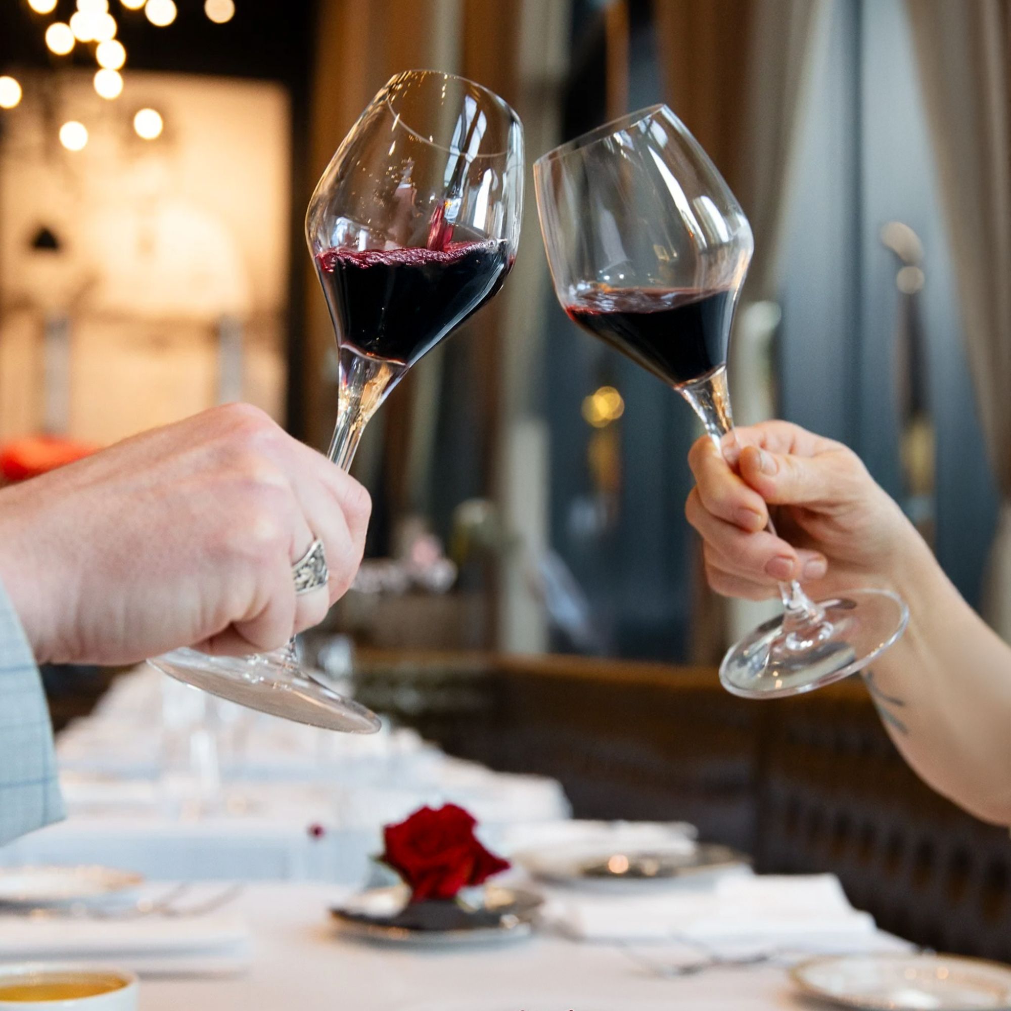 Guests raising wine glasses during a private event at Acquafarina